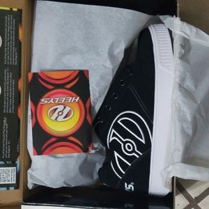 Brand new in box Heely's